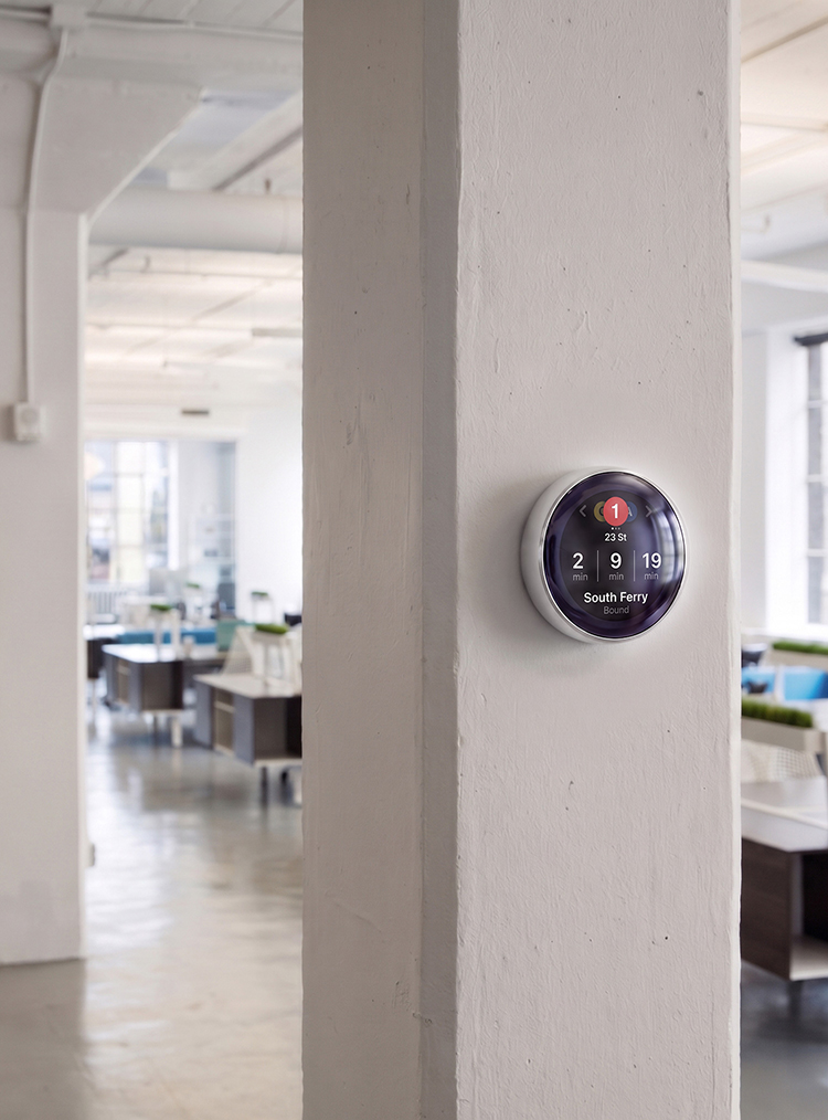 Circ mounted on a right-side office pillar showing train arrival times
